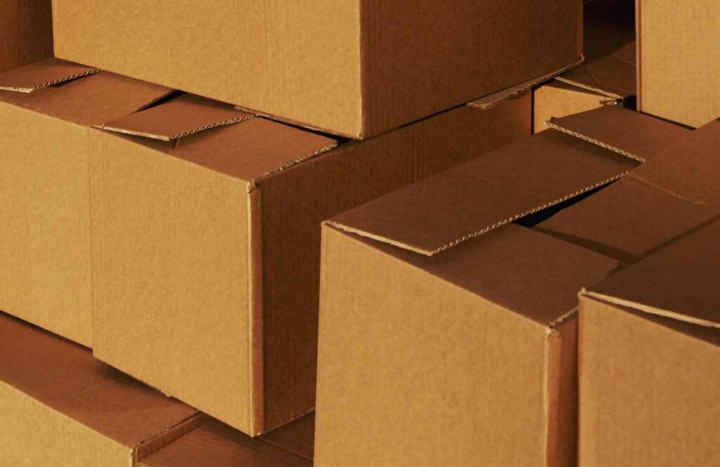 Stacked cardboard moving cartons ready to be bought for a New Zealand house move Stacked cardboard moving cartons ready to be bought for a New Zealand house move