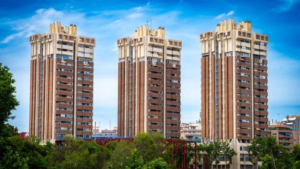 Modern residential apartment towers, the kind of CBD building where moves depend on a lift booking